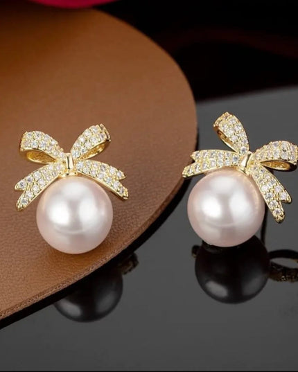 Bow pearl stud earnings